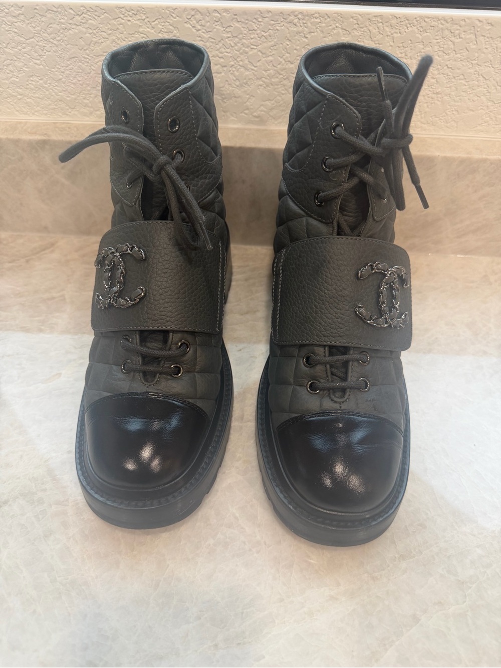 CHANEL Black Quilted Leather Combat Boots with Patent Toe